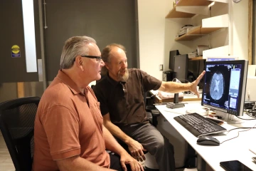 Kevin & Scott Looking at an MRI image on a computer screen